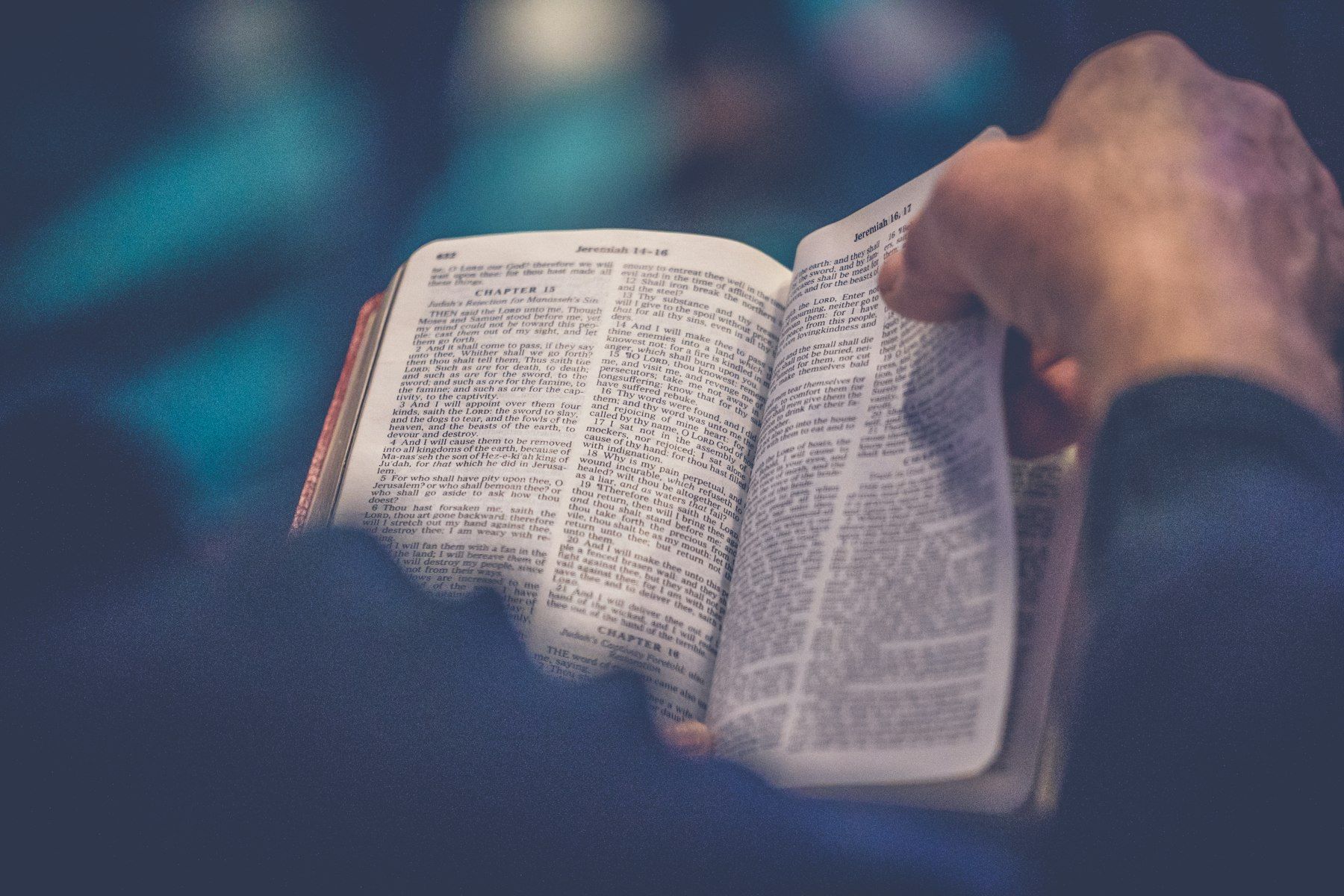An open Bible on a lap