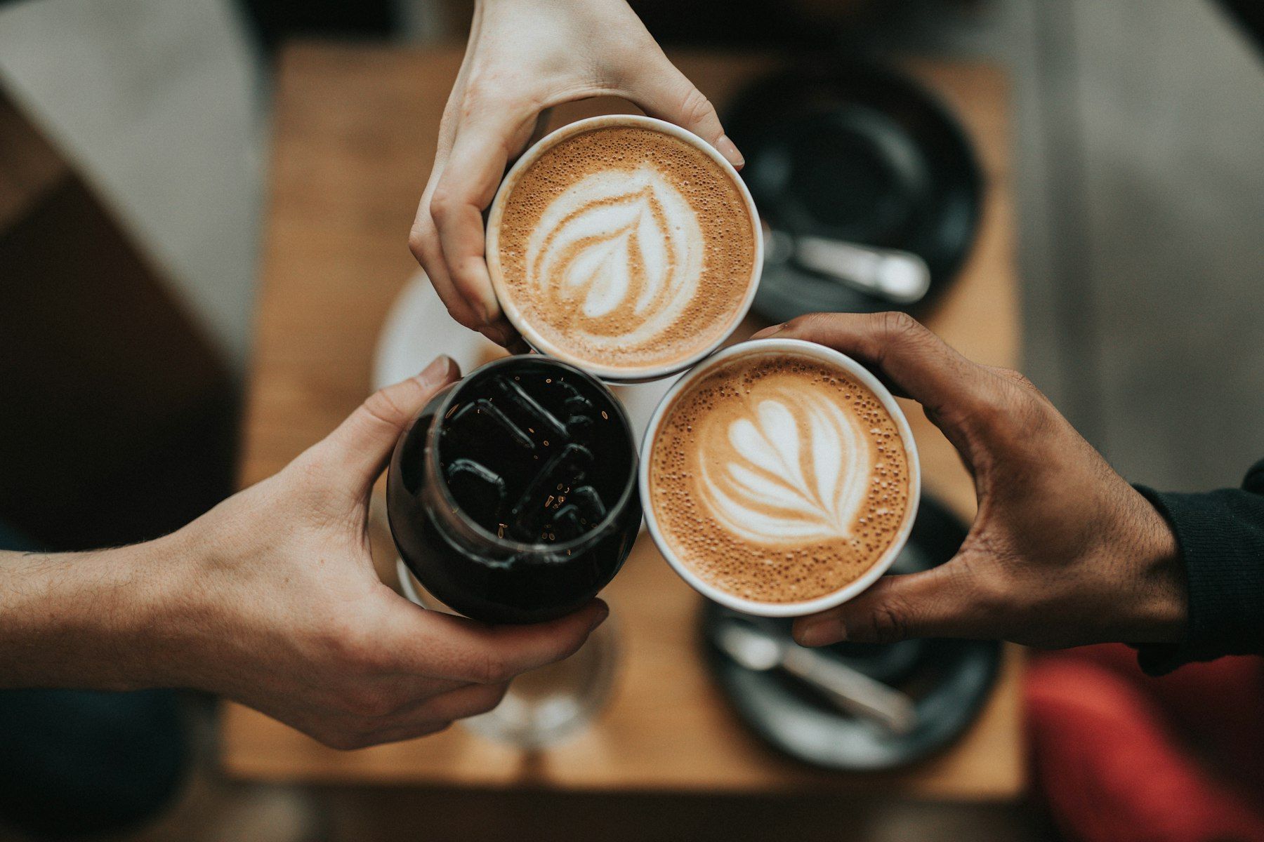 Friends toasting coffee cups