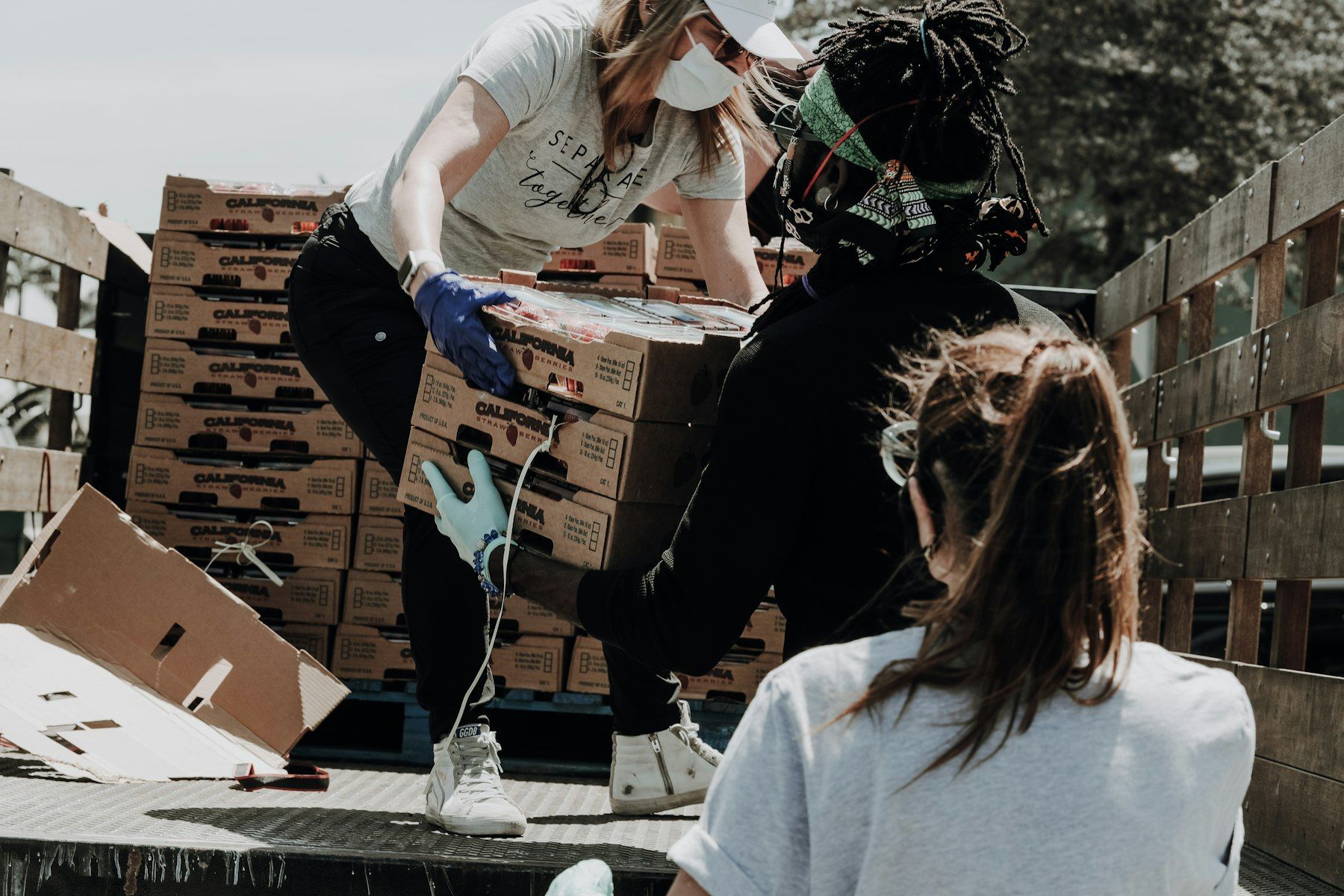 Volunteers loading food boxes